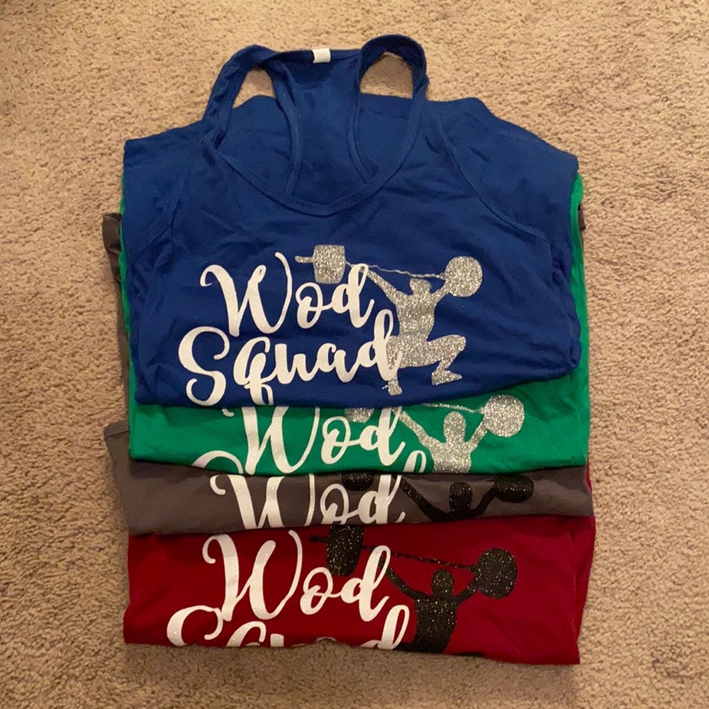 Set of four Racerback Tanks that say “WOD Squad”
